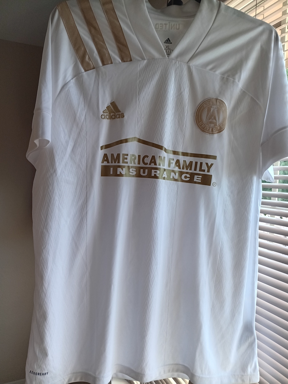 adidas White and Gold Kids Soccer Jersey with Sponsor Crest